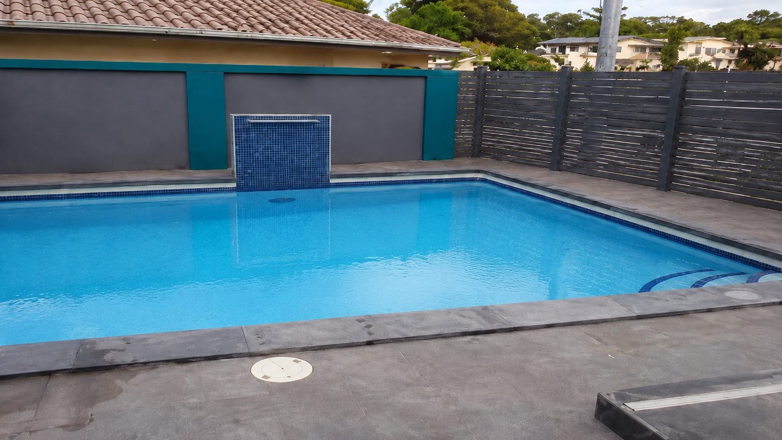 After: the pool with clear, blue water